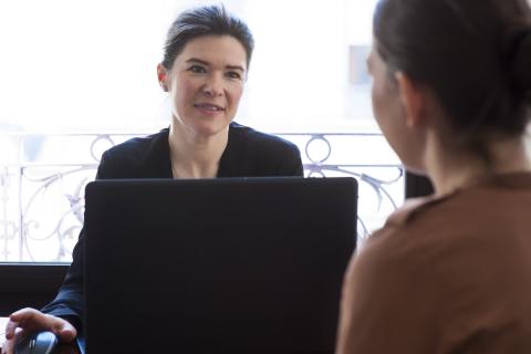 Lawyer speaks with a client
