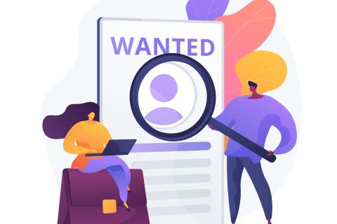 Help wanted sign with man holding magnifying glass