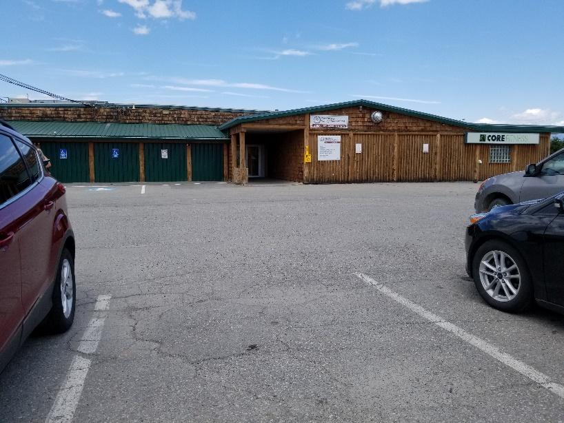 Building entrance next to parking lot