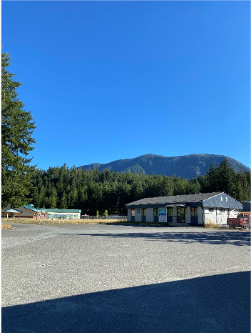 Building in front of a mountain backdrop