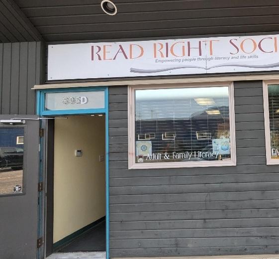 Entrance door with windows and sign