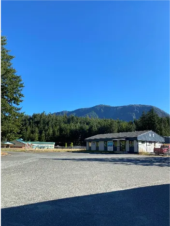 Building in front of a mountain backdrop