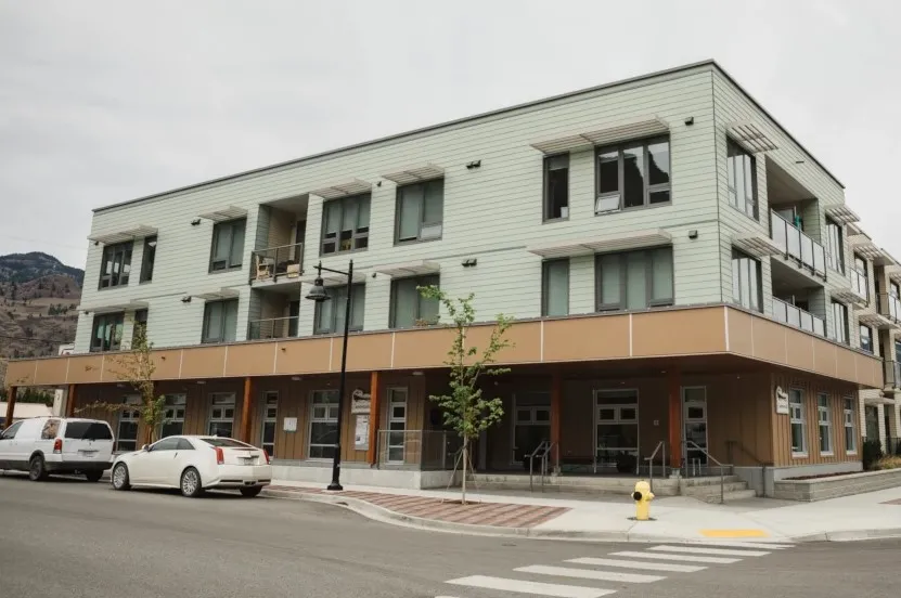 Office building with cars parked in front