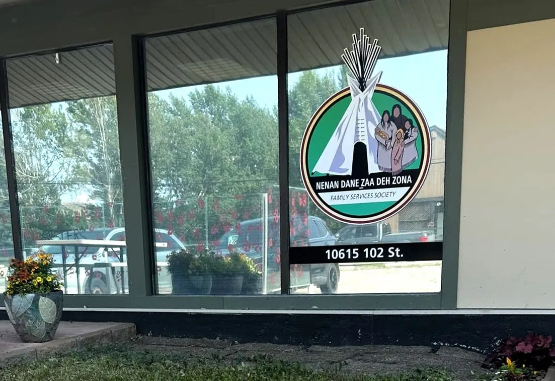 Exterior window sign beside front door